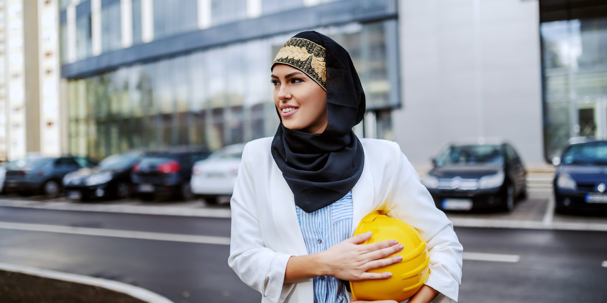 Arabic Young Woman With Hardhat Being Carried Aspect Ratio 1160 580